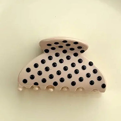 cream hair clip with black dots