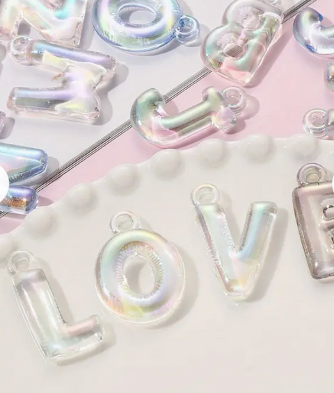 Holographic Alphabet Charms