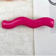 Two small wavy barrette hair clips in a vibrant magenta pink
